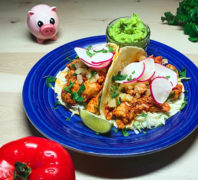 Chicken al pastor tacos on a blue plate