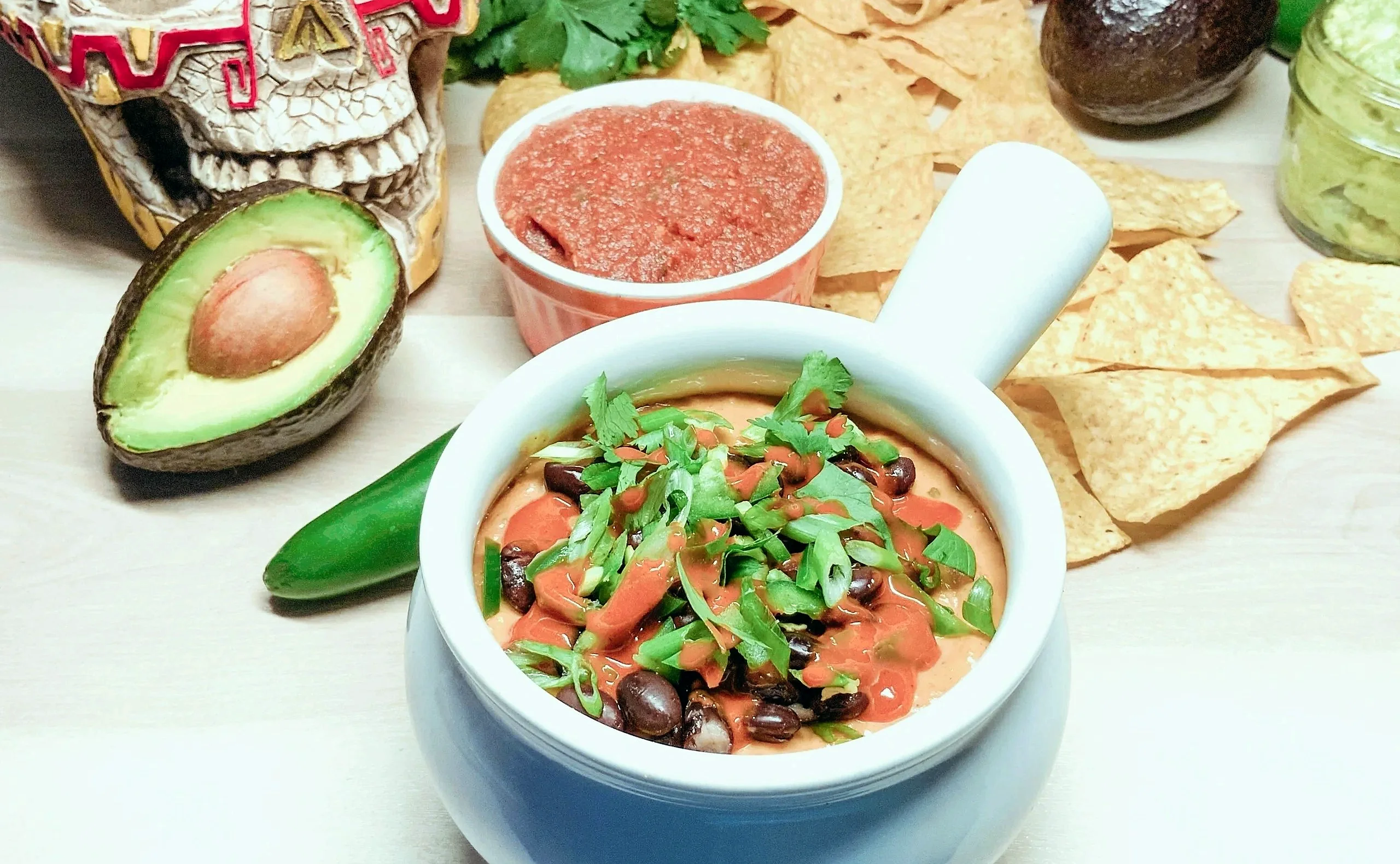 Queso fundido, salsa and guacamole with tortilla chips