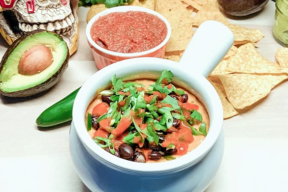 Queso fundido with salsa, guacamole and tortilla chips